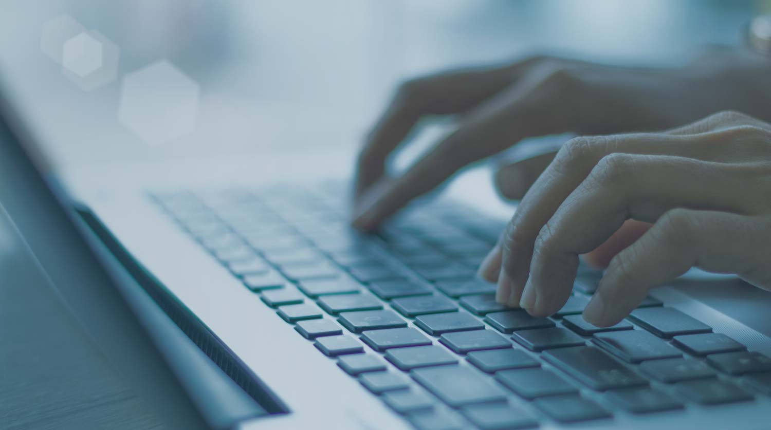 Fingers on a keyword typing to search for CV examples.